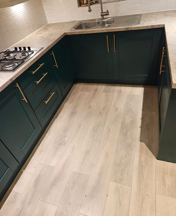 Forest green shaker kitchen with gold handles